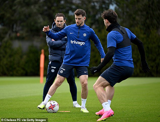 Lampard (left) watches on in training as Mount takes part in a session at Cobham