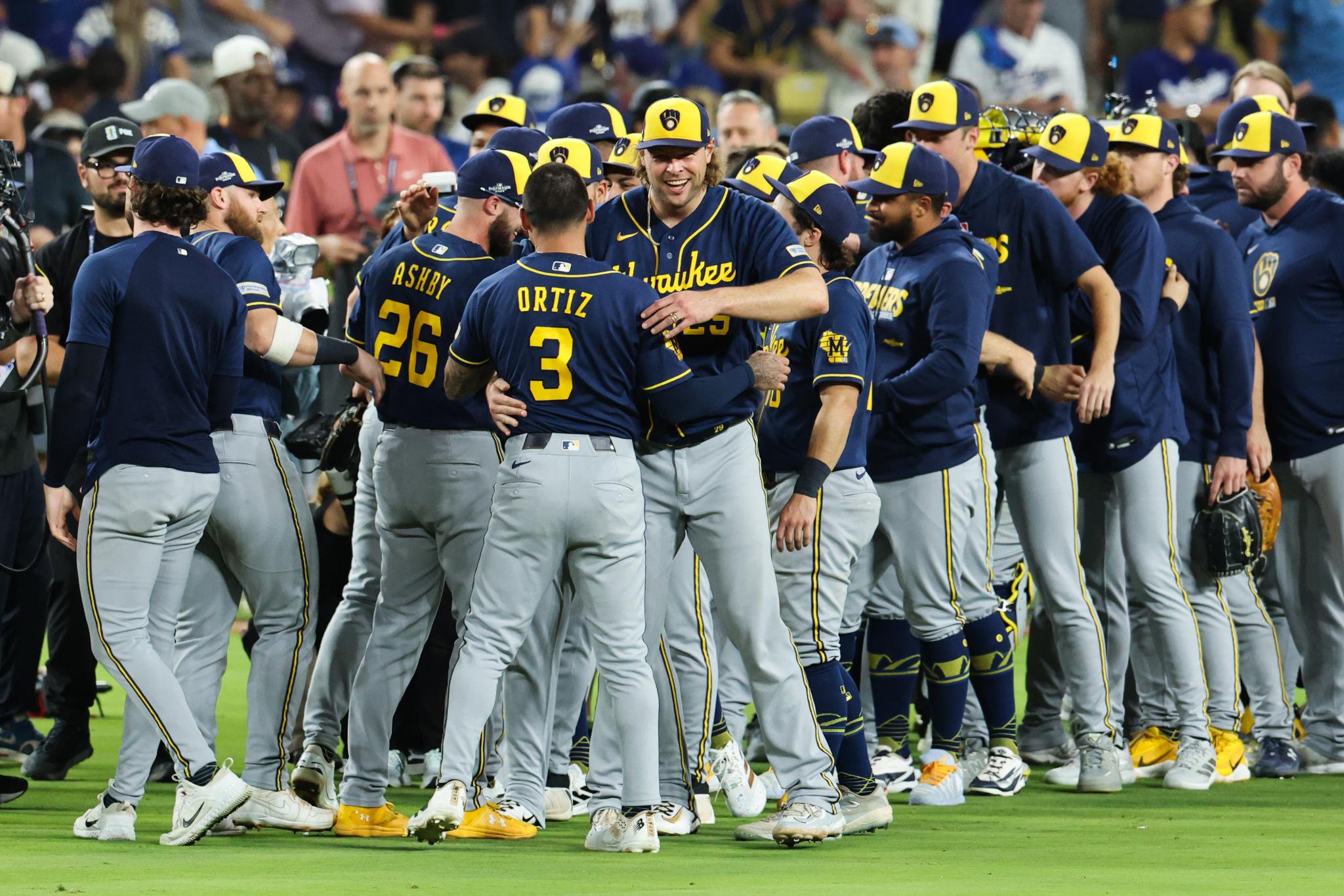 Milwaukee Brewers players celebrate winning NLCS Game 4 against the Los Angeles Dodgers.
