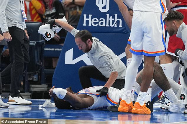 Oklahoma City Thunder guard Jalen Williams is attended to by medical staff during the second half of an NBA basketball game against the Los Angeles Clippers, Sunday, Oct. 25, 2026, in Oklahoma City. (AP Photo/Kyle Phillips)