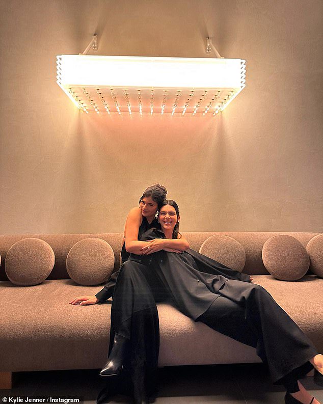 Sweet: The 25-year-old makeup mogul had her arms wrapped around Kendall in a slideshow of loved-up snaps shared to Instagram