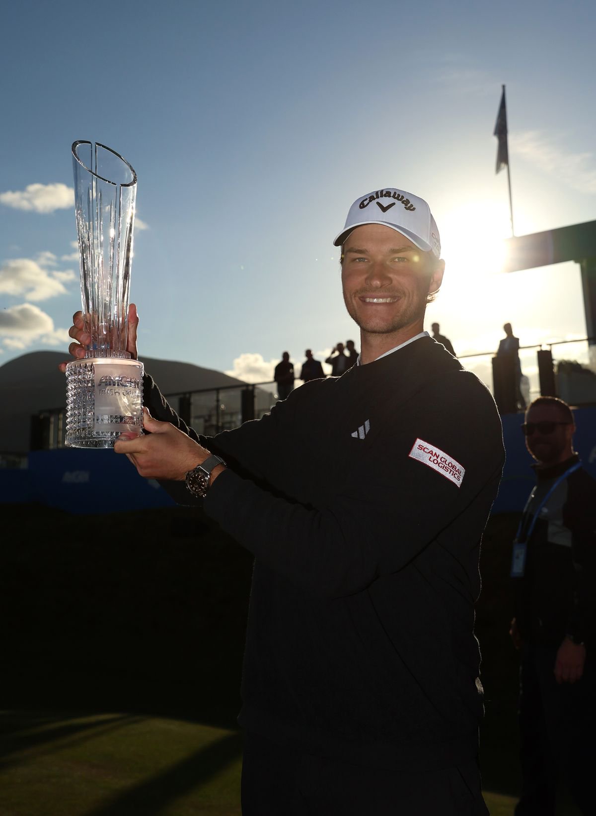 Rasmus Hojgaard of Denmark with the trophy on the 18th green after winning the Amgen Irish Open