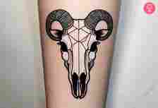 Black sheep skull tattoo on the forearm of a woman