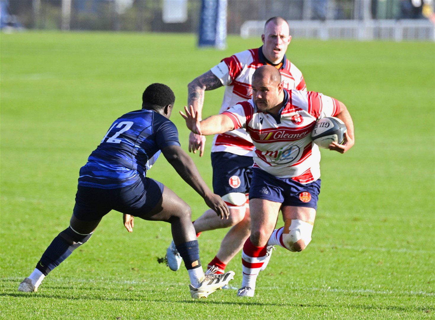 Johnny Haslam hands off defender, supported by Hugh MacRae. Picture: James Officer