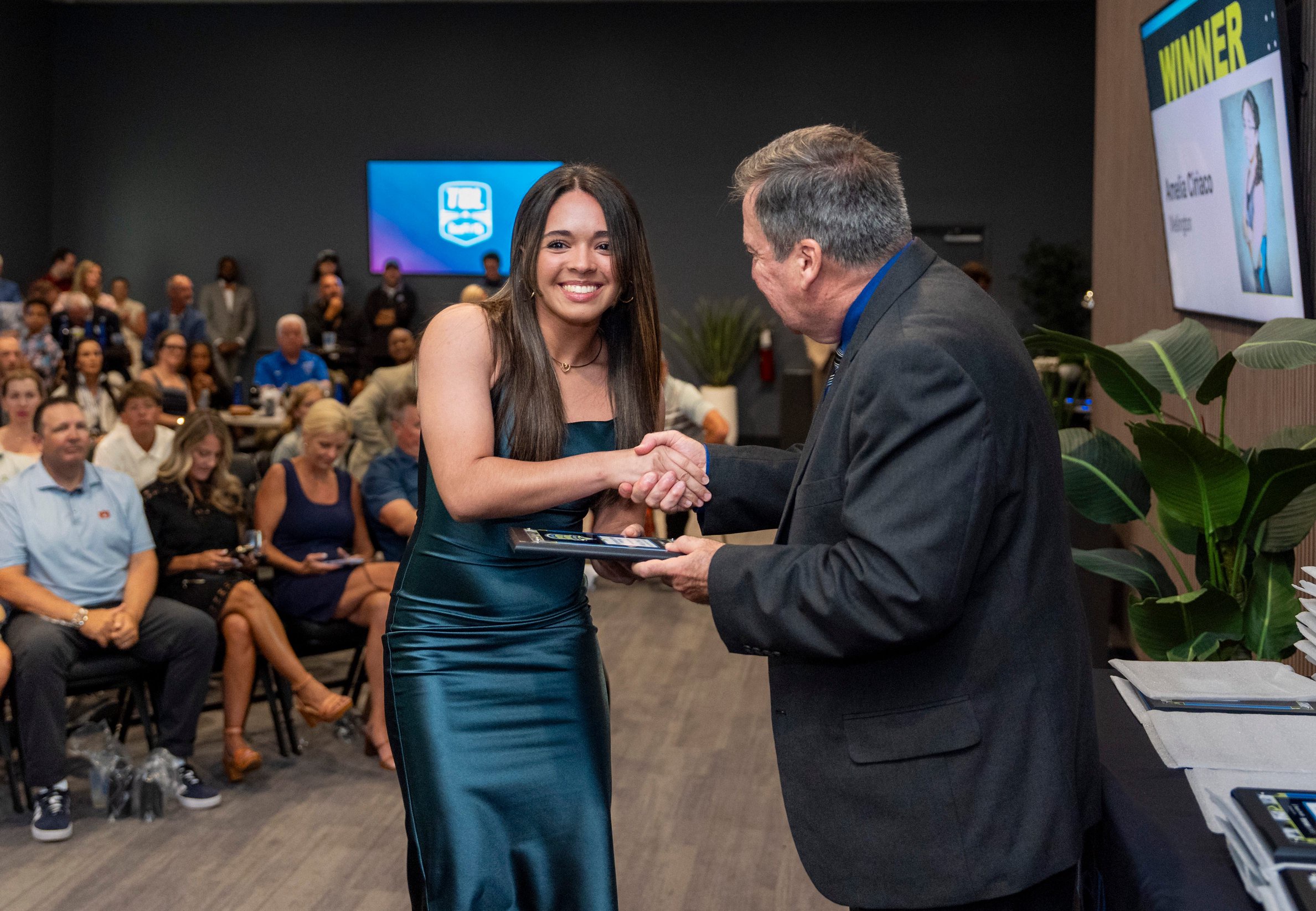 Girls Weightlifter of the Year Amelia Ciriaco of Wellington receives her award from Palm Beach Post Sports Editor Nick Pugliese At the Palm Beach County High School Sports Awards at SoFi Center on May 28, 2026, in Palm Beach Gardens, Florida.