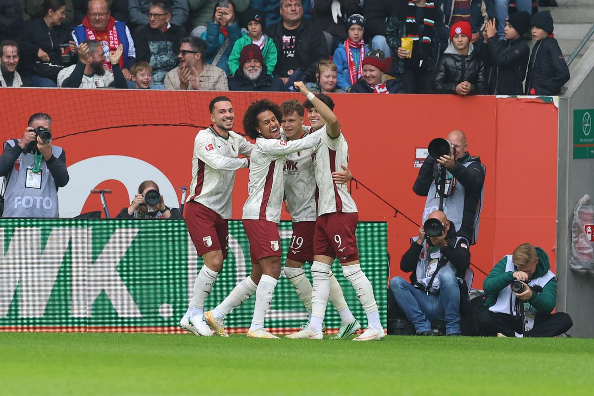 Robin Fellhauer of Augsburg celebrates scoring his team’s first goal 