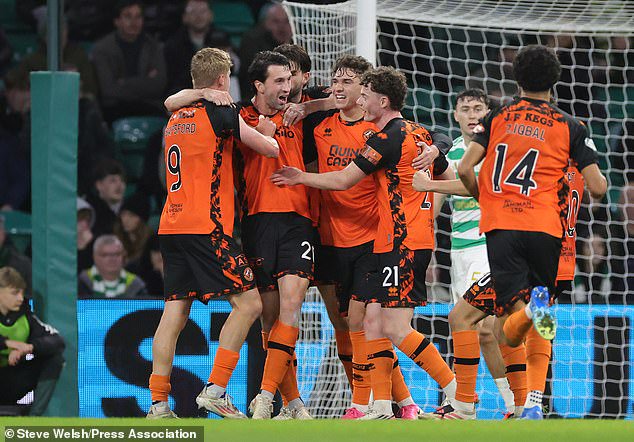 Dundee United celebrate going 2-1 up at Parkhead but had to settle for a point in the end