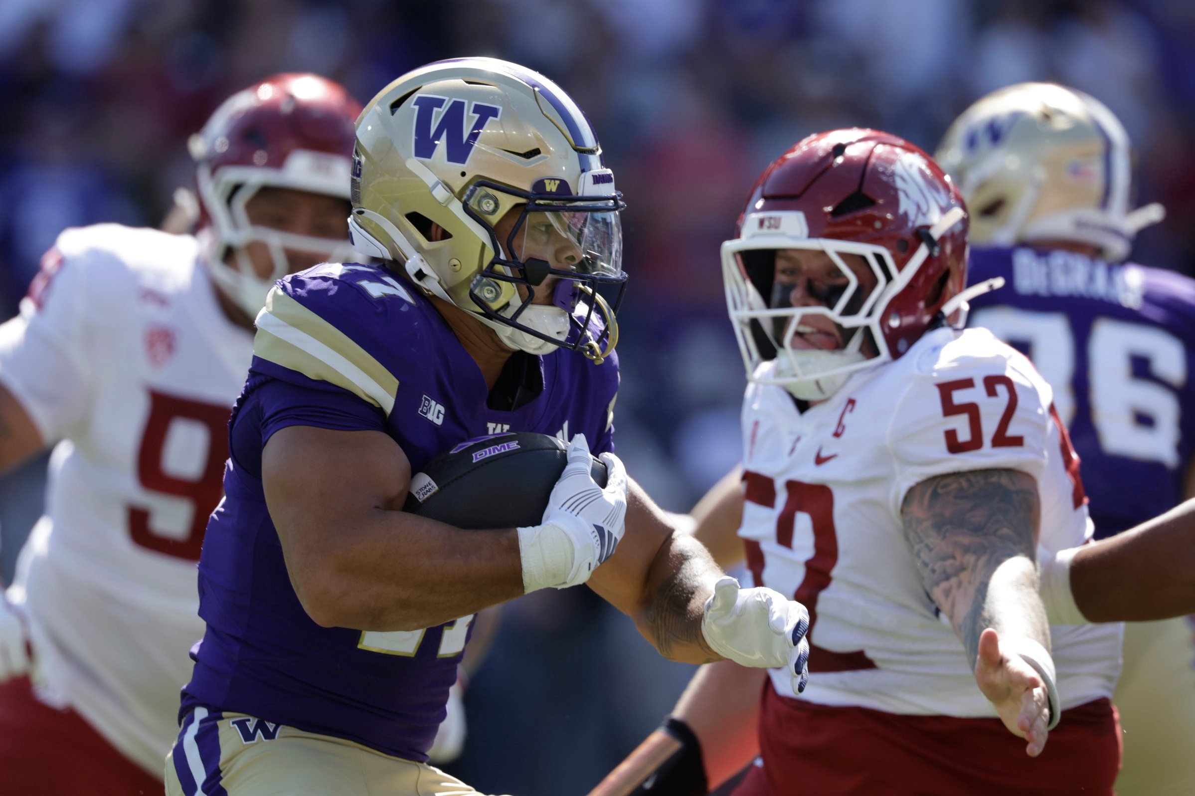 Sep 6, 2026; Seattle, Washington, USA;  Washington Huskies running back Jayden Limar (17) carries the ball for the first down against the Washington State Cougars during the second quarter at Husky Stadium.  Mandatory Credit: Joe Nicholson-Imagn Images