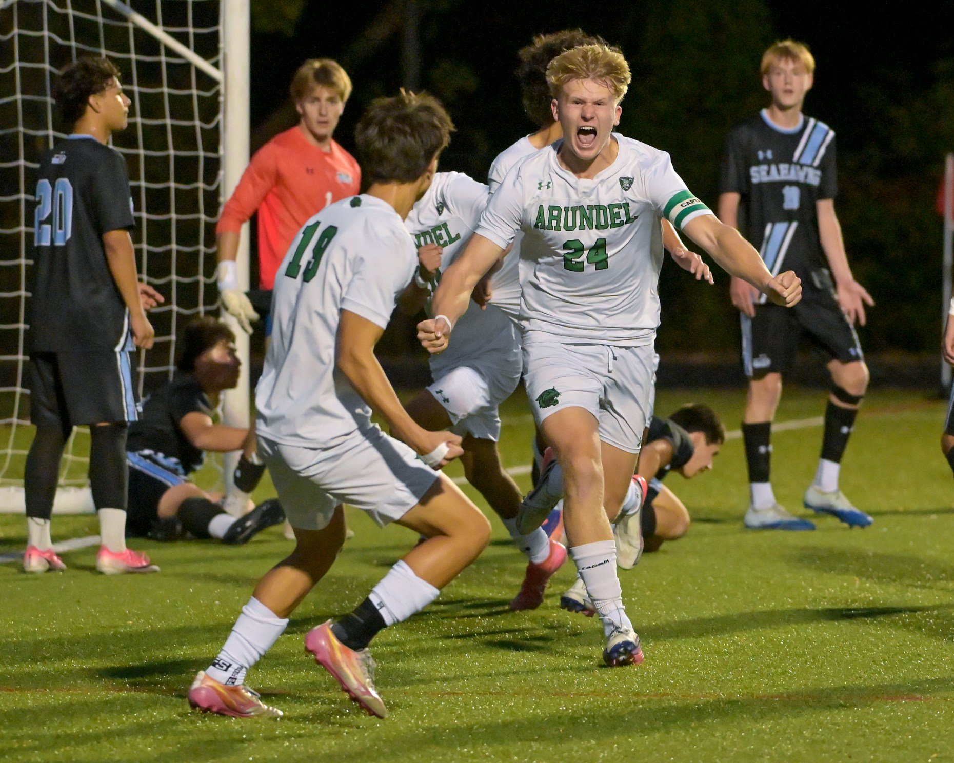 Arundel Wildcats Eli Johnstone-Clark #24 celebrates with teammates after scoring during the first half. The visiting Arundel Wildcats defeat the South River Seahawks, 2-1, in overtime in an MPSSAA Class 3A East II quarterfinal boys soccer game Wednesday evening. (Paul W. Gillespie/Staff)