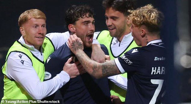 Dundee's Callum Jones celebrates with team-mates after taking advantage of Neil mistake
