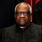 Clarence Thomas returns after unexplained absence as Supreme Court hears Jan. 6 case