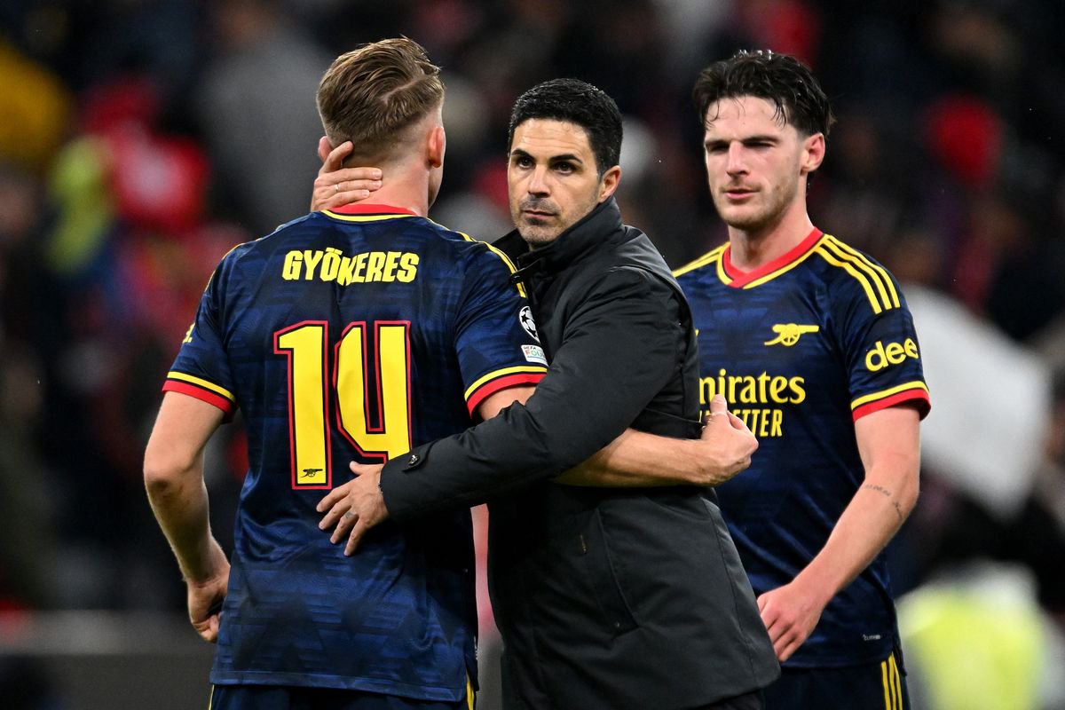 Mikel Arteta, Manager of Arsenal, celebrates with Viktor Gyokeres and Declan Rice of Arsenal after the UEFA Champions League 2026/27 League Phase MD3 match between FC Bayern München and Arsenal FC at Football Arena Munich on October 21, 2026 in Munich, Germany
