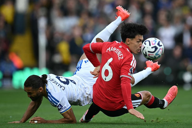Leeds United's Dominic Calvert-Lewin is challenged by Lisandro Martinez at Elland Road. Photograph: Paul Ellis/AFP via Getty Images