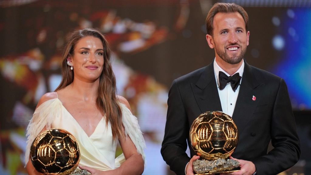 England's soccer player Harry Kane and Spain's Alexia Putellas with the Ballon d'Or trophies. (AP Photo)