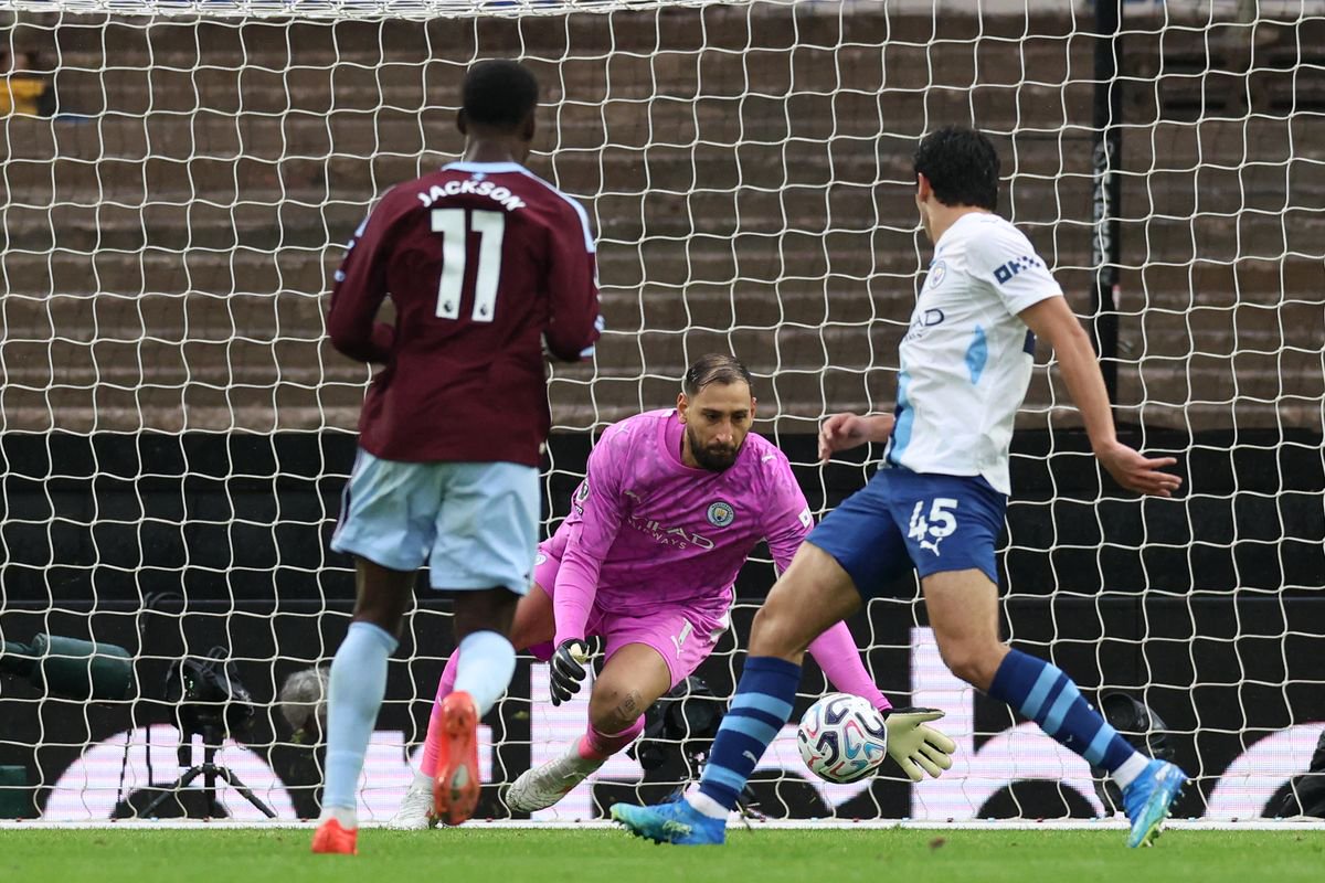 Manchester City goalkeeper Gianluigi Donnarumma allows Aston Villa's Nicolas Jackson's shot to squirm through him 