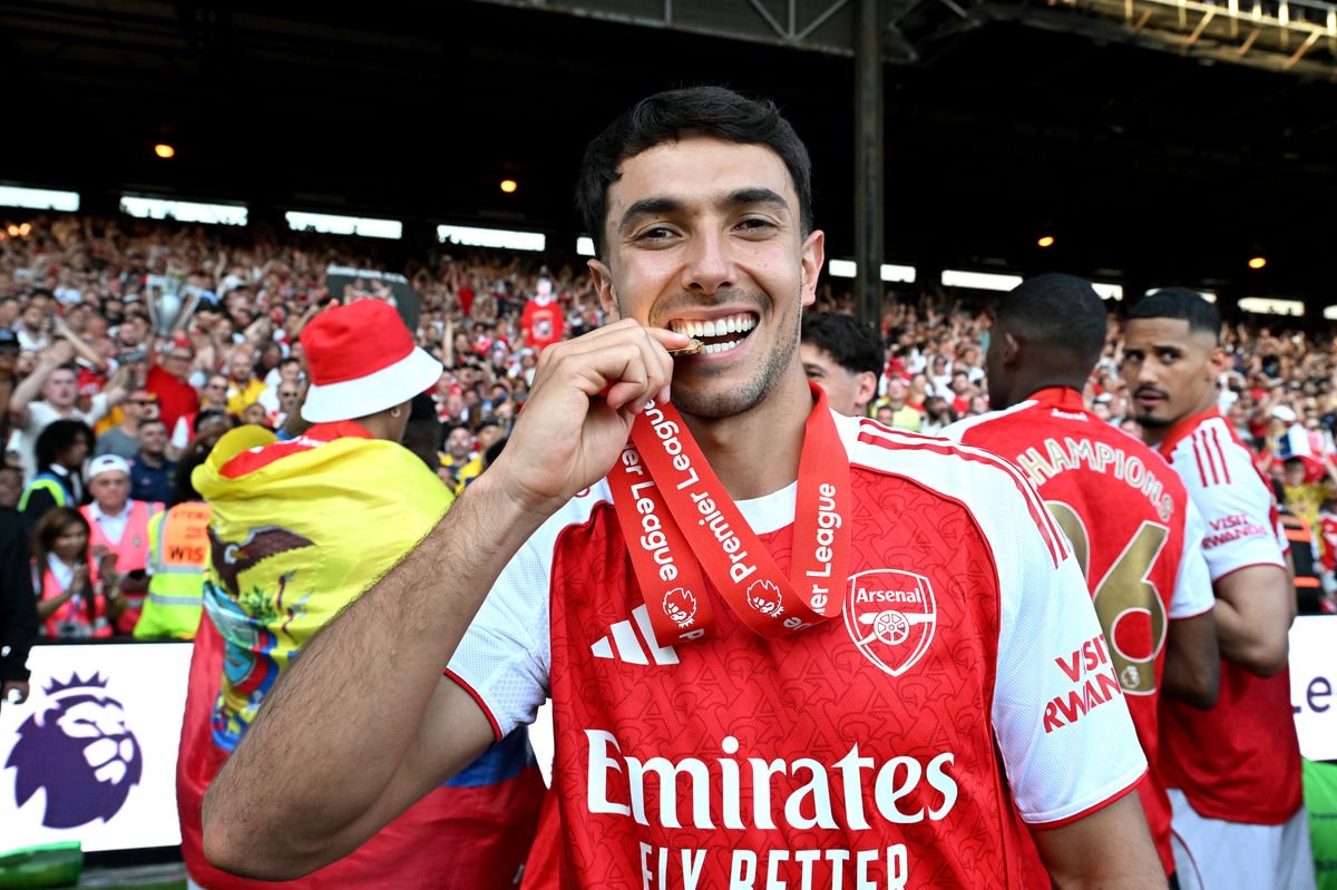 Martin Zubimendi of Arsenal bites his Premier League winners medal as he celebrates, as Arsenal are crowned the Champions of the Premier League for the 2025/26 Season, after the Premier League match between Crystal Palace and Arsenal at Selhurst Park on May 24, 2026 in London, England
