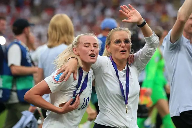 Chloe Kelly and Sarina Wiegman celebrate after they win the UEFA Women's Euro 2022