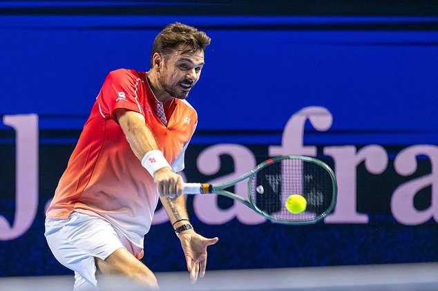 Switzerland's Stan Wawrinka returns a shot to Czech Republic's Jiri Lehecka during the first round of the Swiss Indoors tennis tournament in Basel, Switzerland, Tuesday, Oct. 27, 2026. (Georgios Kefalas/Keystone via AP)