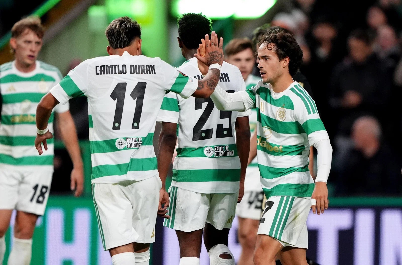 Celtic's Mika Baur (right) celebrates with team-mates after scoring the opening goal in the Europa League match