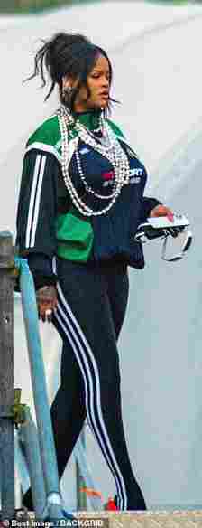 Stunner: The Barbados-born star, 34 - who recently gave birth to the couple's first child - looked incredible in a pair of skintight Adidas leggings and a matching sporty windbreaker