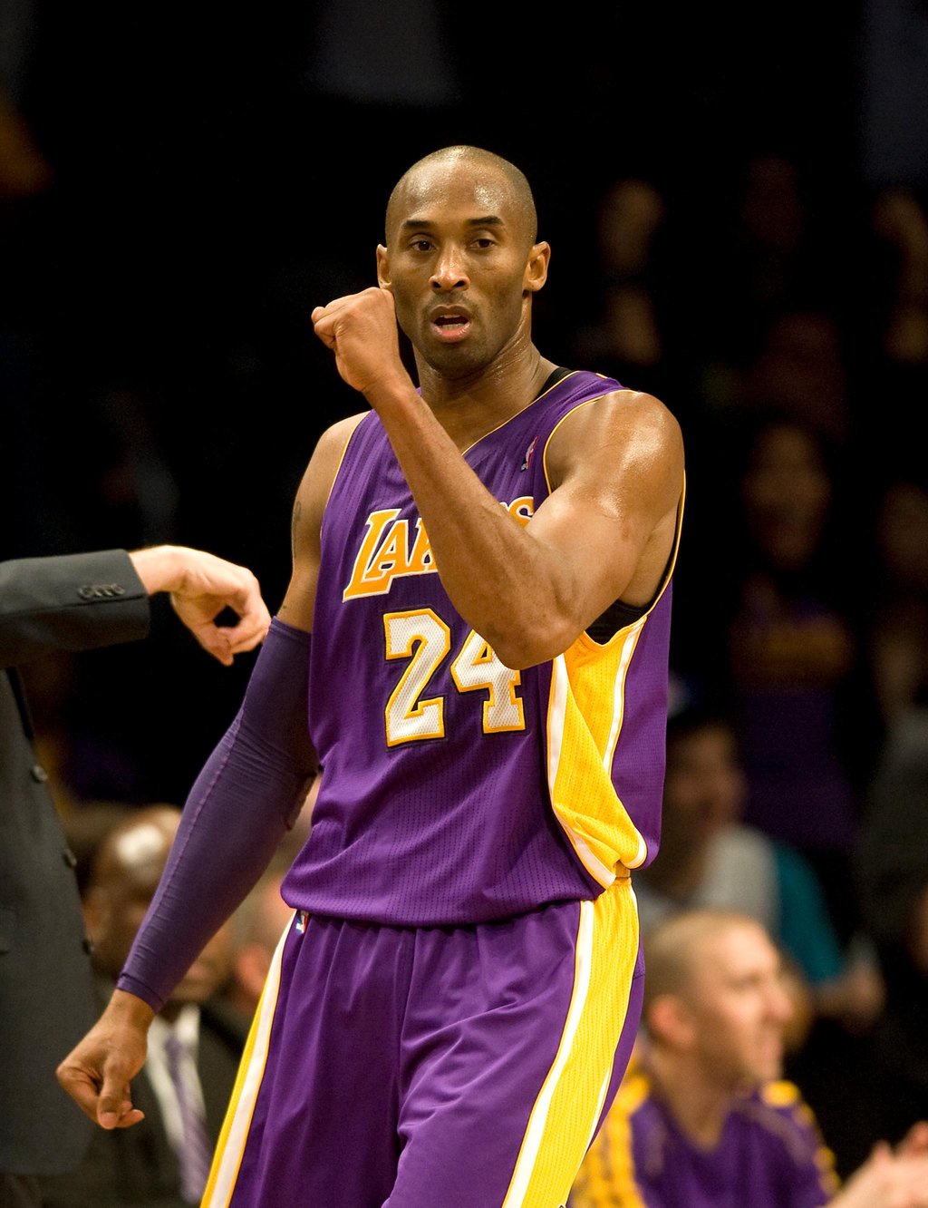 Kobe Bryant celebrating on the court in his Lakers uniform.