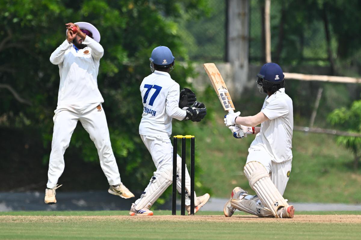Andhra's Ricky Bhui takes a catch to dismiss Hyderabad's Ruthvik Yadav.