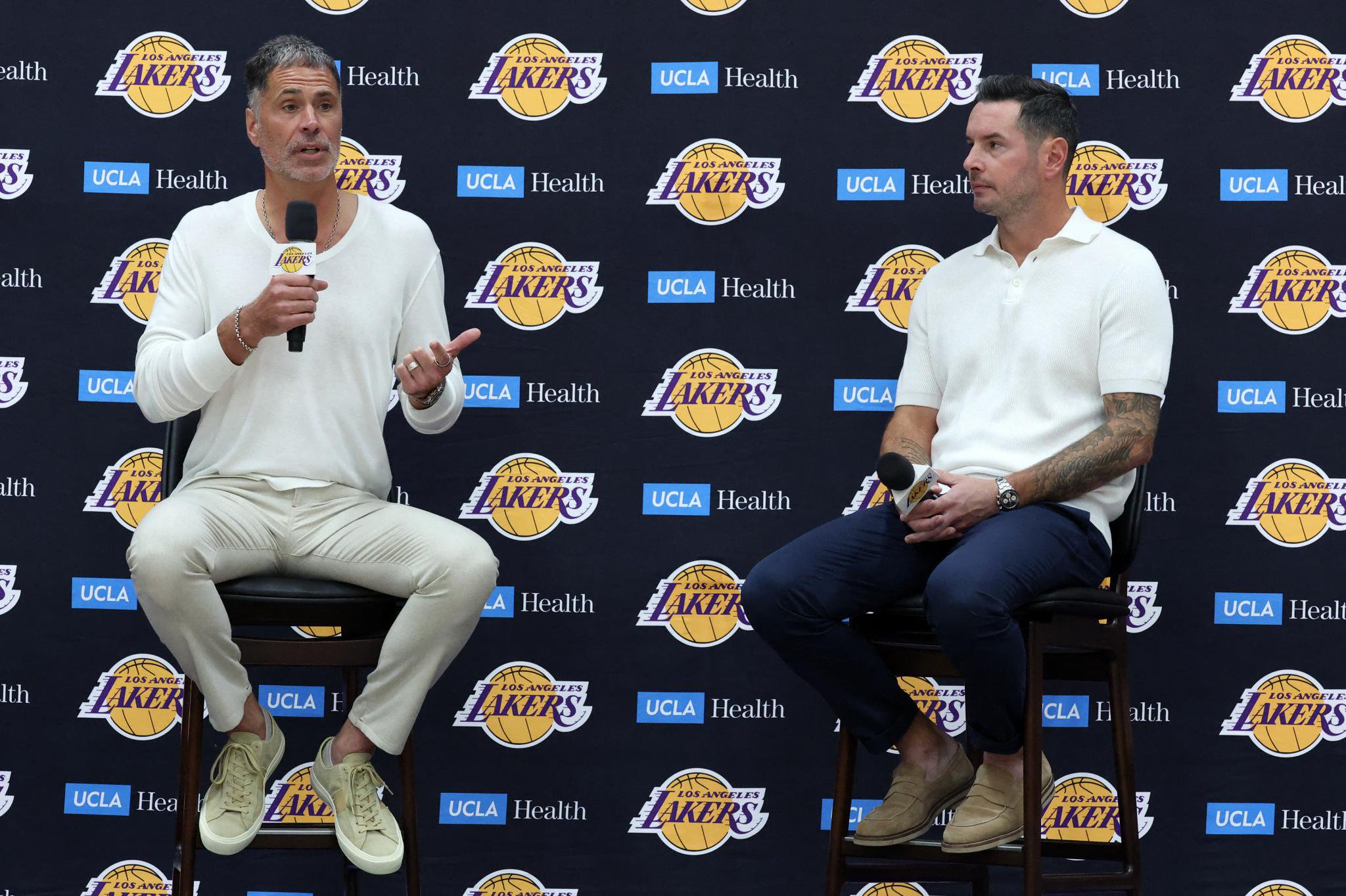 Los Angeles Lakers president of basketball operations and general manager Rob Pelinka, left, and head coach JJ Redick speak to the media during a press conference at UCLA Health Training Center in Los Angeles, Thursday, Sept. 24, 2026.