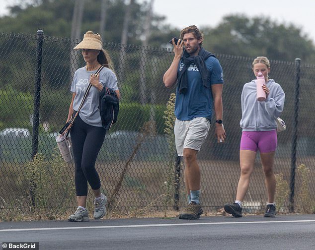 Christopher showcased his ripped physique in a blue T-shirt with white gym shorts and brown sneakers while on the walk with the two important women in his life