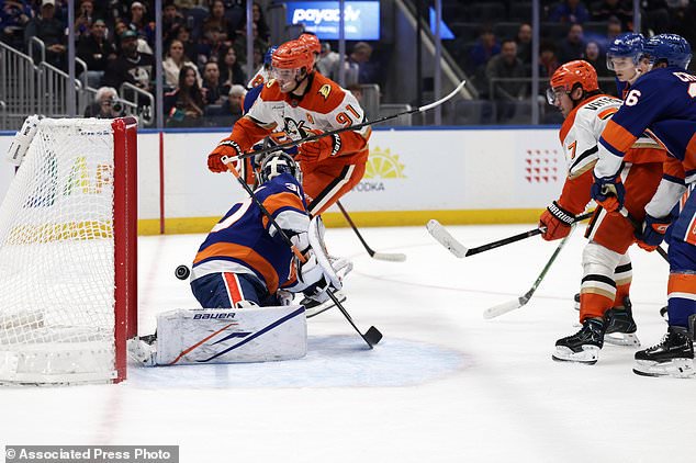 Anaheim Ducks right wing Frank Vatrano (77) scores a goal past New York Islanders goaltender Ilya Sorokin during the first period of an NHL hockey game Tuesday, Oct. 20, 2026, in Elmont, N.Y. (AP Photo/Adam Hunger)