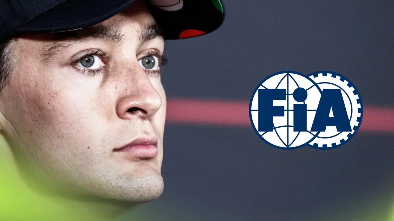 A close-up shot of George Russell in a press conference with an FIA logo alongside him