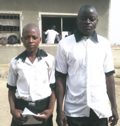 Meet the father who is in the same class with his son in school (photos) 1