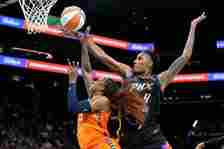Connecticut Sun guard Tiffany Mitchell, left, is fouled by Phoenix...