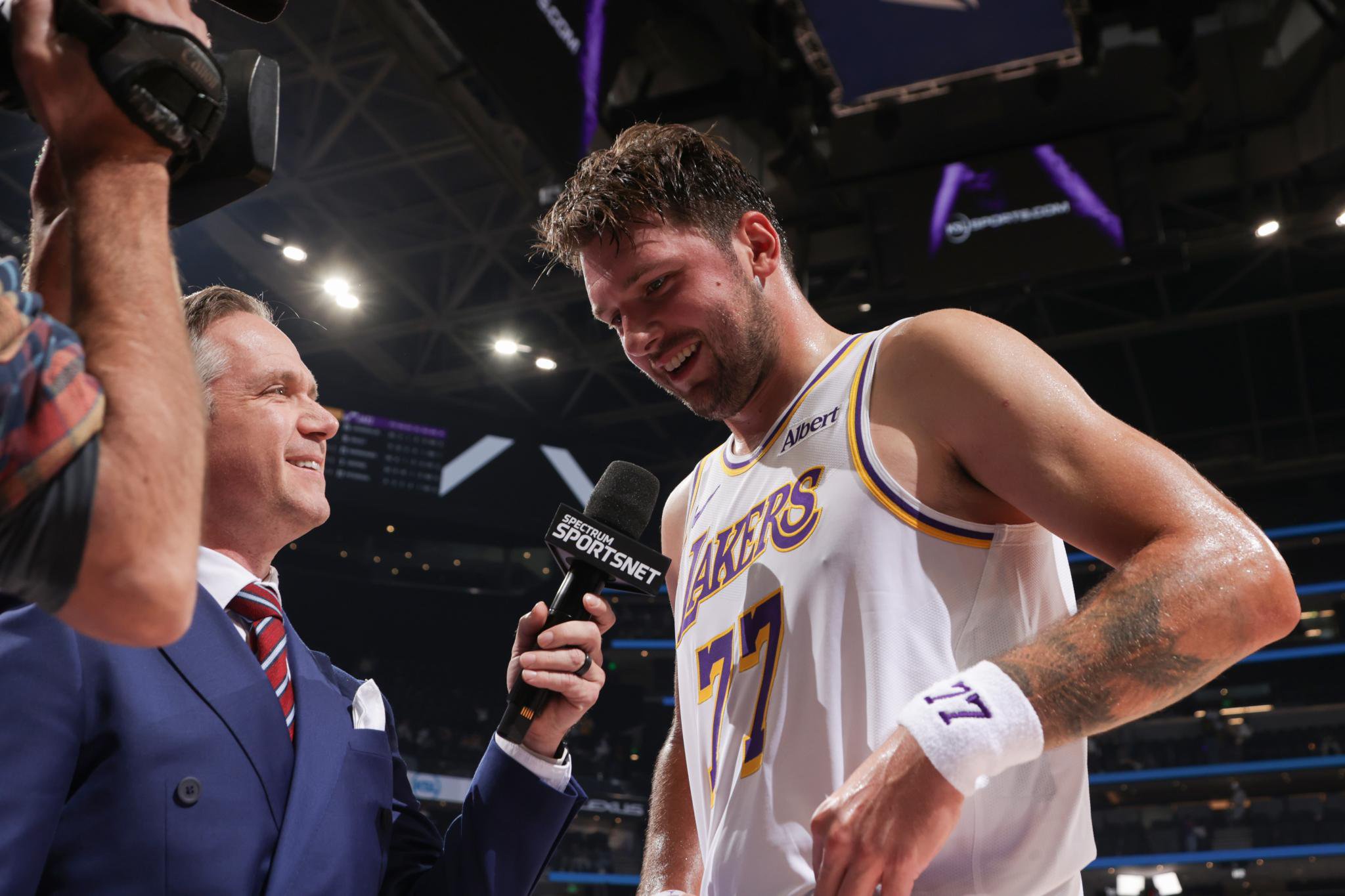 Los Angeles Lakers player Luka Doncic (77) smiles while talking to the media.