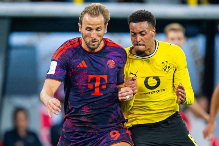 Harry Kane und Felix Nmecha kämpfen um den Ball.