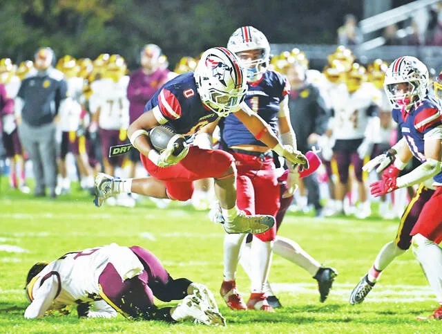 <p>Pittston Area’s Kayden Bailey (0) hurdles the last Wyoming Valley West defender to score on a 11-yard run.</p>
                                 <p>Tony Callaio | For Times Leader</p>