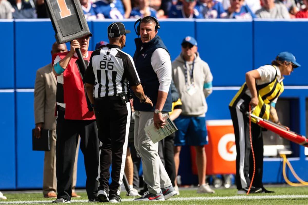 Head Coach Mike Vrabel of the New England Patriots talks to an official
