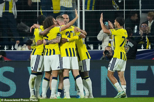 Fenerbahce players celebrate after their teammate Mason Greenwood scores the second goal against Slavia Praha during the Champions League opening phase soccer match between Fenerbahce and Slavia Praha in Istanbul, Turkey, Tuesday, Oct. 20, 2026. (AP Photo/Emrah Gurel)