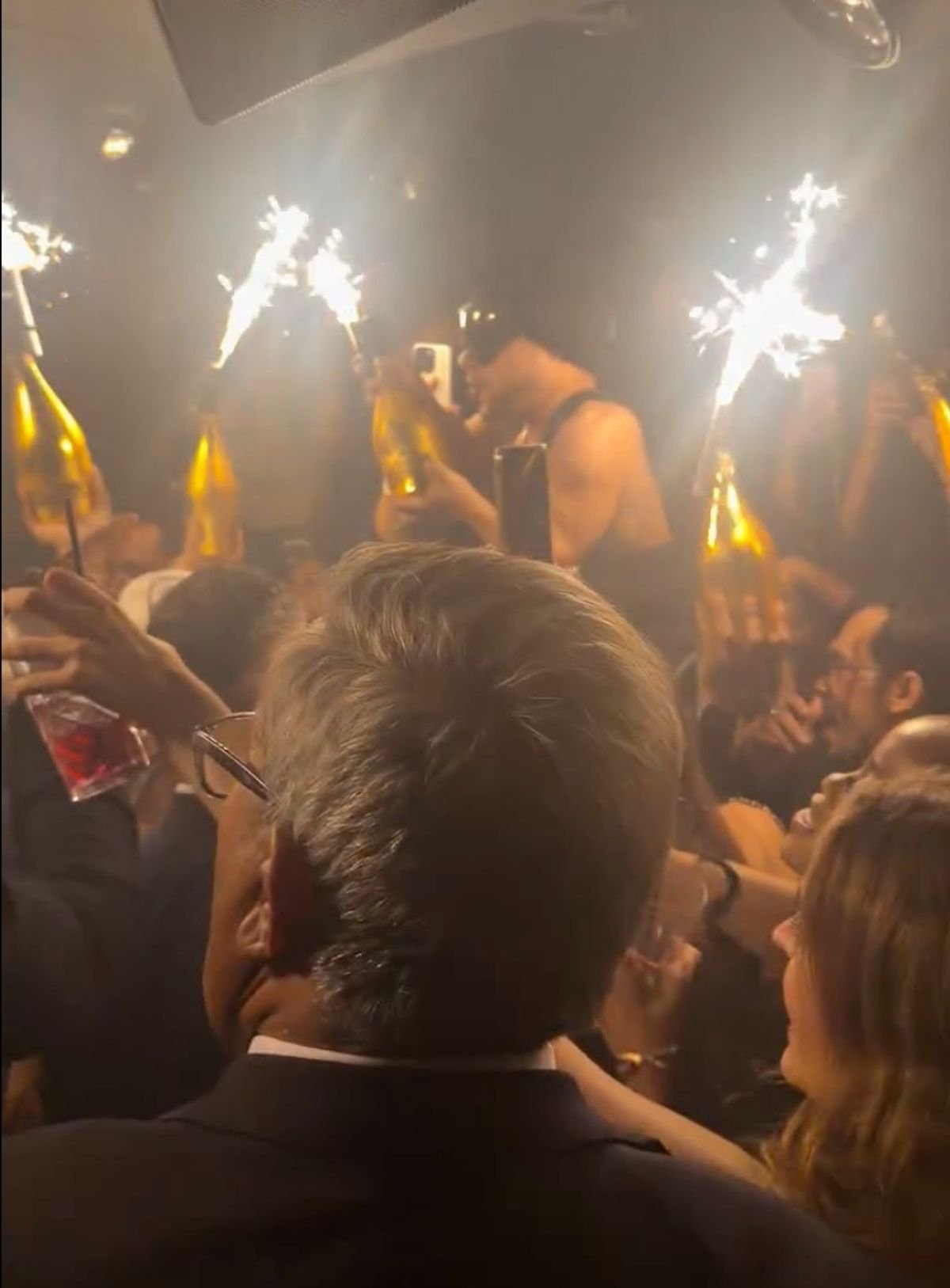 Gold champagne bottles with sparklers were brought out for Kane