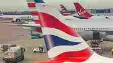 British Airways, American Airlines, and Virgin Atlantic aircraft at LHR shutterstock_2454166267