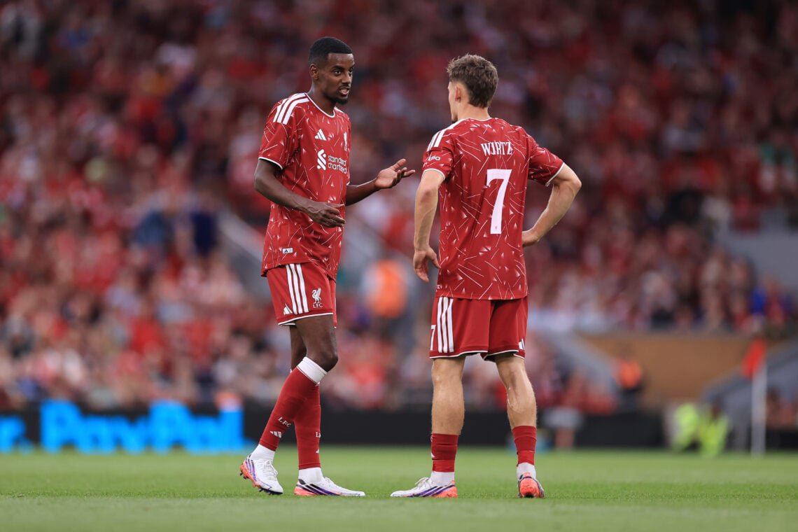 Alexander Isak and Florian Wirtz pictured in discussion during Liverpool's pre-season friendly against Como at Anfield
