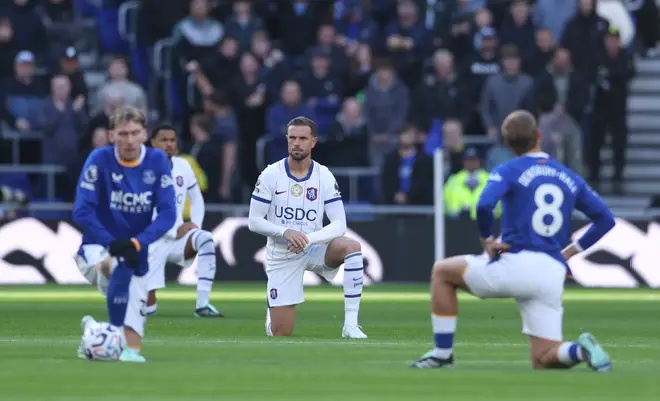 Everton and Chelsea players take the knee before Saturday's game. Everton's Ainsley Maitland-Niles opted to stay standing