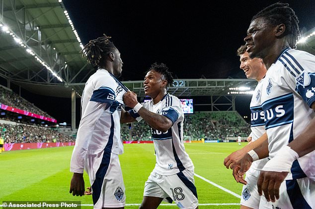Vancouver Whitecaps forward Yadaly Diaby, left, celebrates his goal against Austin FC with defender Édier Ocampo (18), midfielder Aleksa Cvetkovi and forward Emmanuel Sabbi during the second half of an MLS soccer match in Austin, Texas, Saturday, Oct. 17, 2026. (AP Photo/Stephen Spillman)