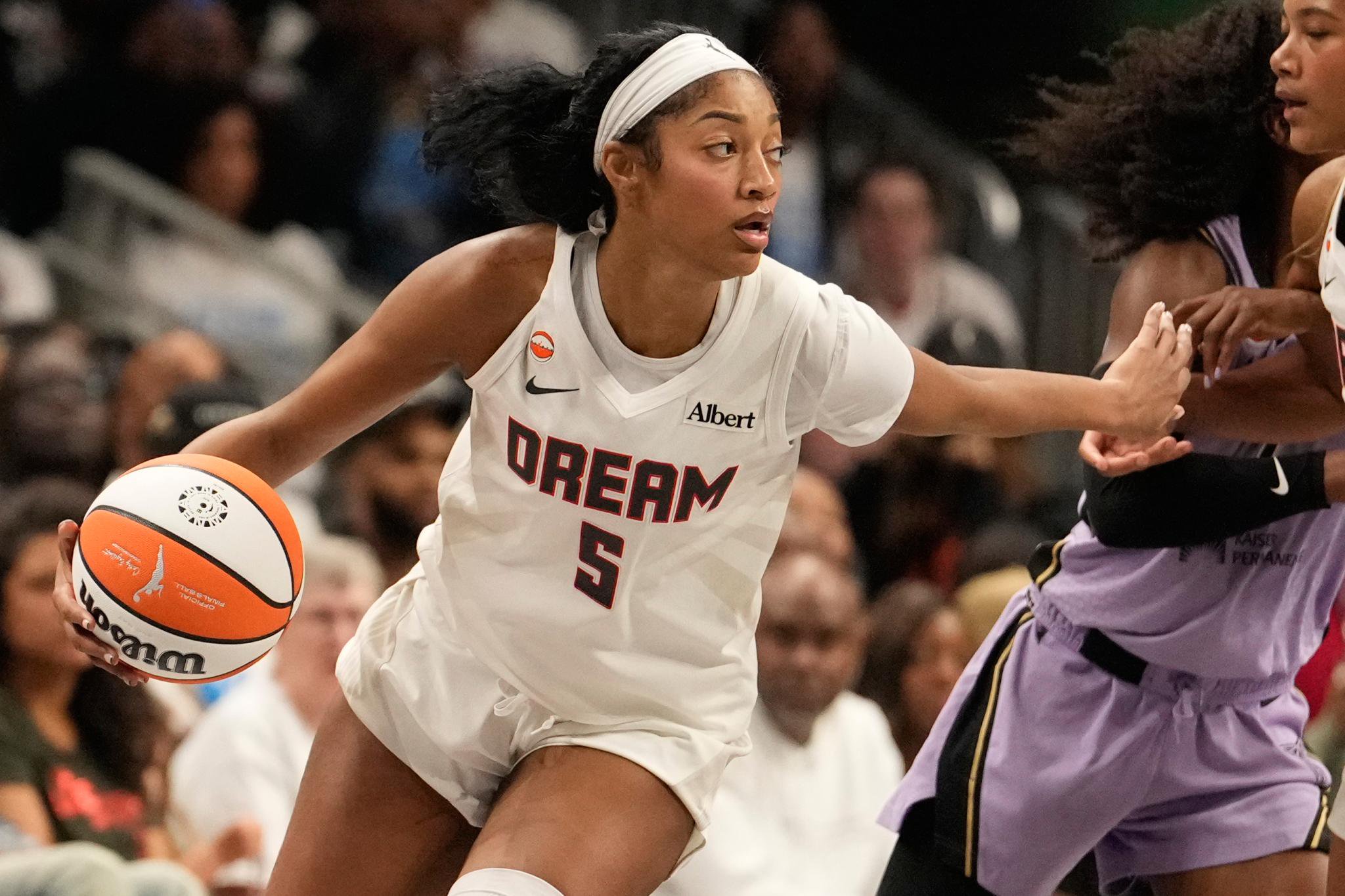Atlanta Dream forward Angel Reese (5) dribbles the ball during Game 4 of the WNBA basketball finals against the Golden State Valkyries.