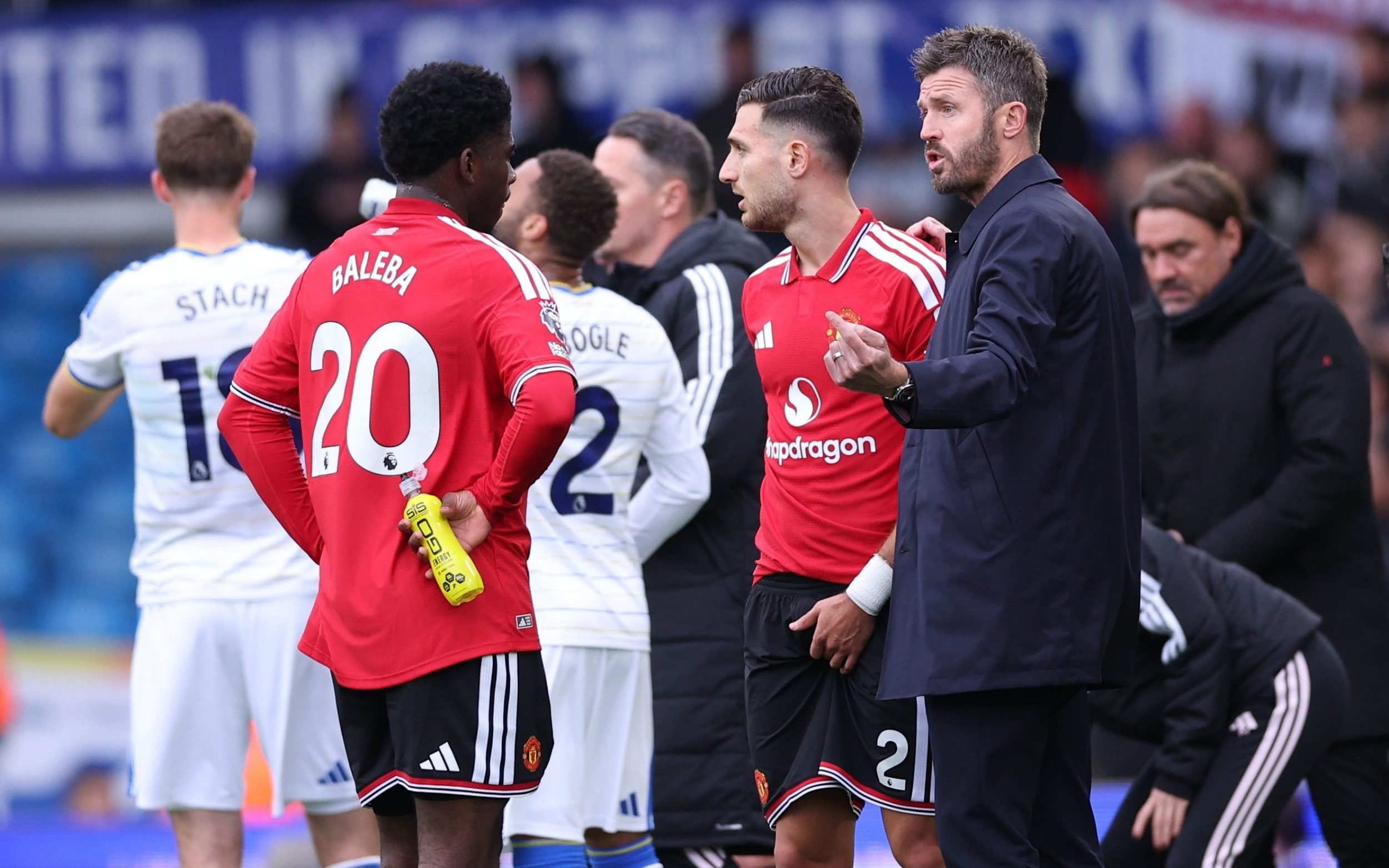 Manchester United manager Michael Carrick speak to Carlos Baleba