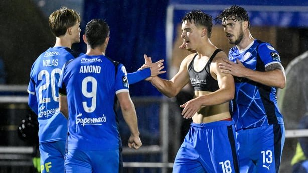 Tommy Lonergan of Waterford celebrates with teammates, from left, Jorgen Voilas, Pádraig Amond and Kevin Long after scoring their side's third goal during the SSE Airtricity Men's Premier Division match between Waterford and Galway United at the RSC in Waterford
