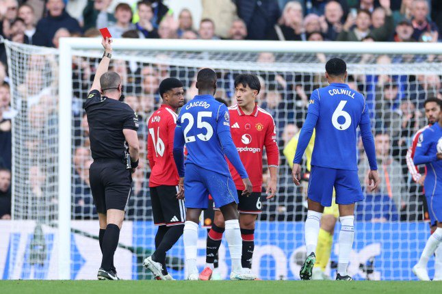 Referee Peter Bankes shows a red card to Manchester United's Lisandro Martinez (6) during the English Premier League soccer match between Chelsea and Manchester United in London, Saturday, Oct. 31, 2026. (AP Photo/Ian Walton)