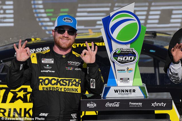 Tyler Reddick celebrates after winning a NASCAR Cup Series auto race Sunday, Oct. 18, 2026, in Avondale, Ariz. (AP Photo/Rick Scuteri)