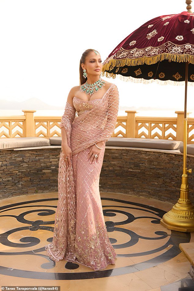 The singer and actress, 56, risked stealing the show in a plunging crystal-covered saree and 168-carat emerald necklace in unseen photographs