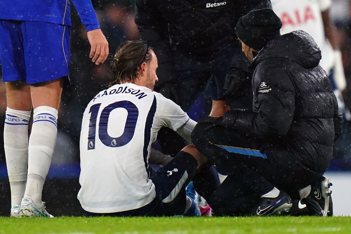  James Maddison of Tottenham Hotspur receives attention after he breaks down injured during the Premier League 2026/27 match between Chelsea FC and Tottenham Hotspur at Stamford Bridge on October 24, 2026 in London, United Kingdom