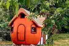 The magic pumpkin is a bright orange, rounded house made to look like a giant winter squash