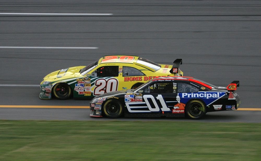 Regan Smith, No. 01, battles Tony Stewart, No. 20, for race win